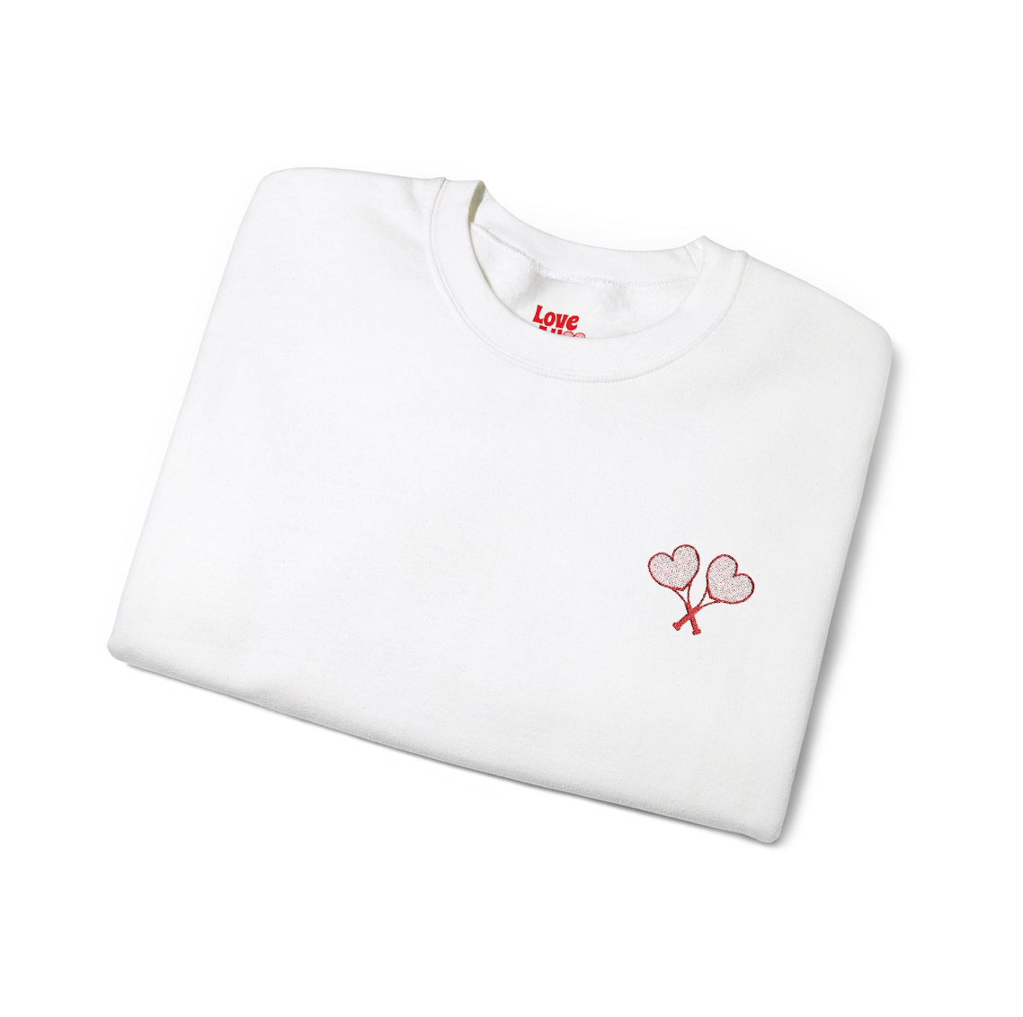 White t-shirt with red heart design and 'LOVE' text on a white background