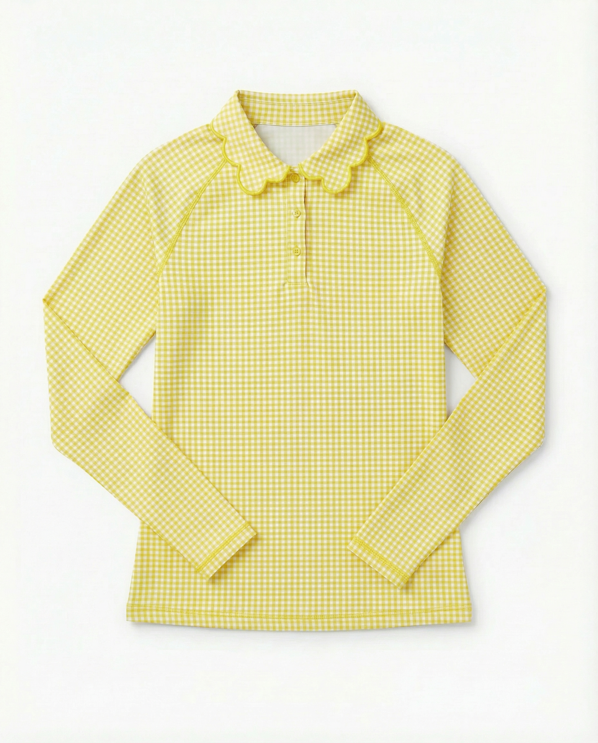 A yellow and white gingham long-sleeve collared shirt with a three-button placket, laid flat against a white background.