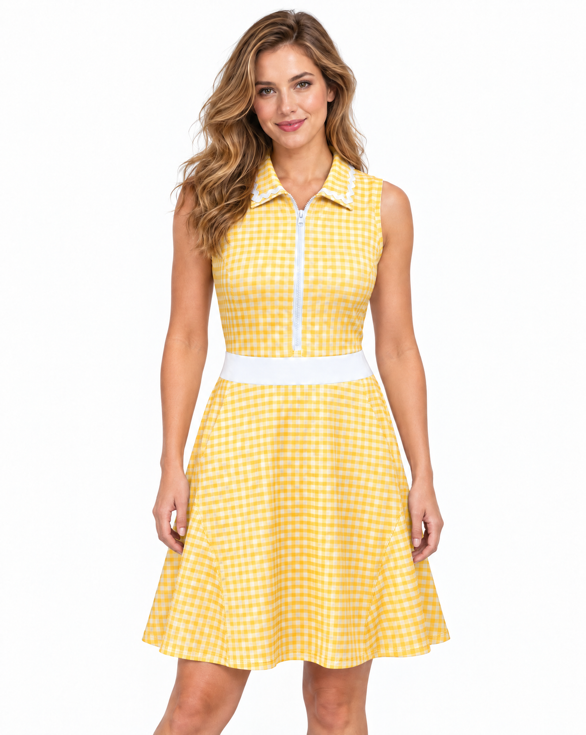 A woman modeling a sleeveless yellow and white gingham dress with a white front zipper, white waistband, and a flared skirt, set against a plain white background.