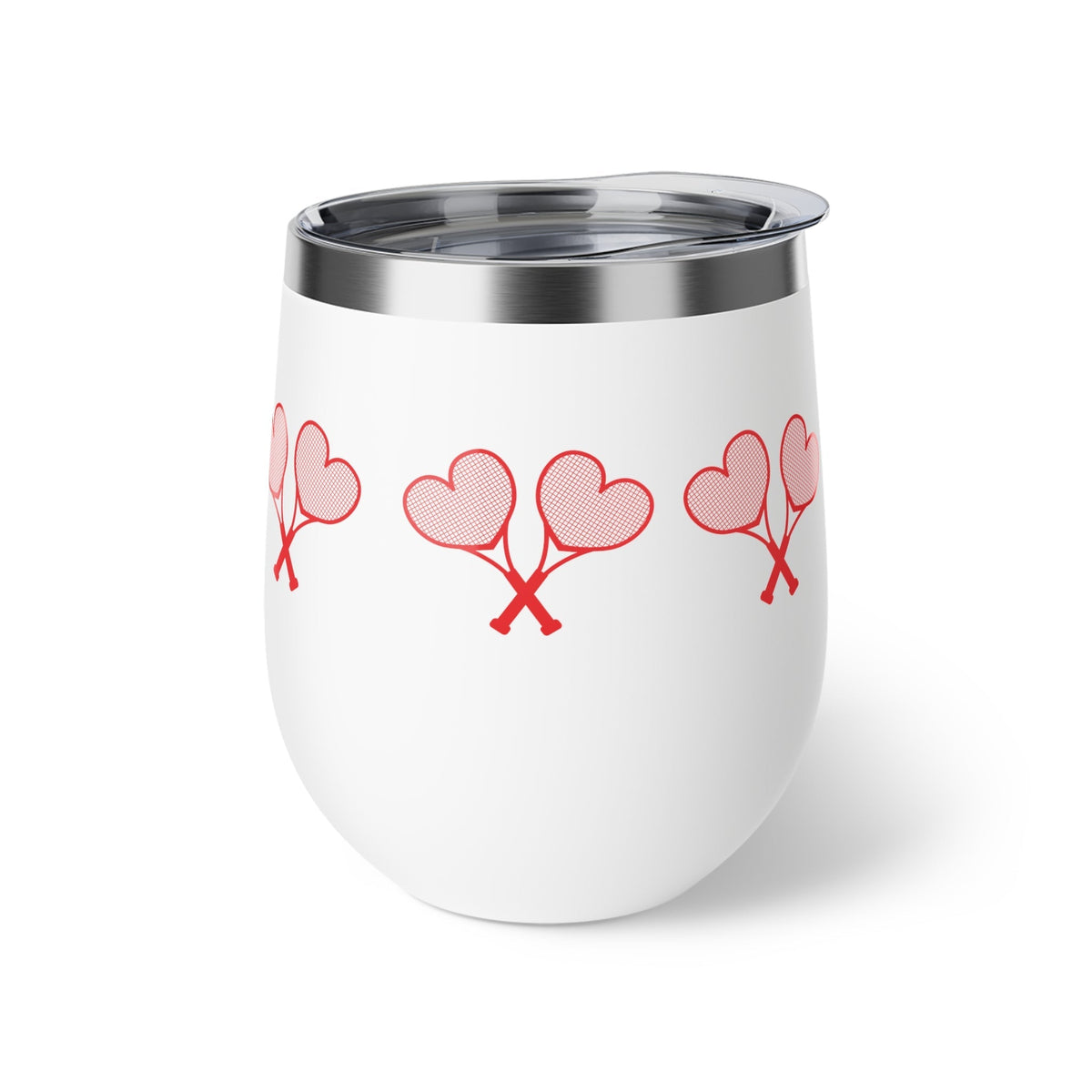 White tumbler with red heart designs on a white background