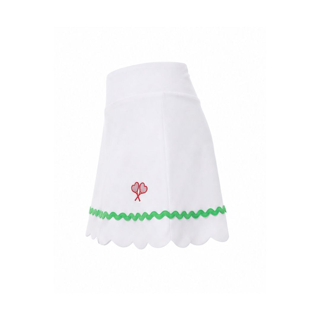 White skirt with green trim and red flower design on a white background