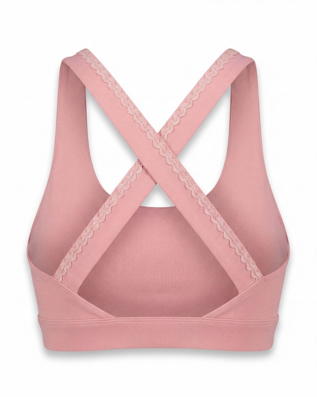 Pink sports bra with lace details on a white background