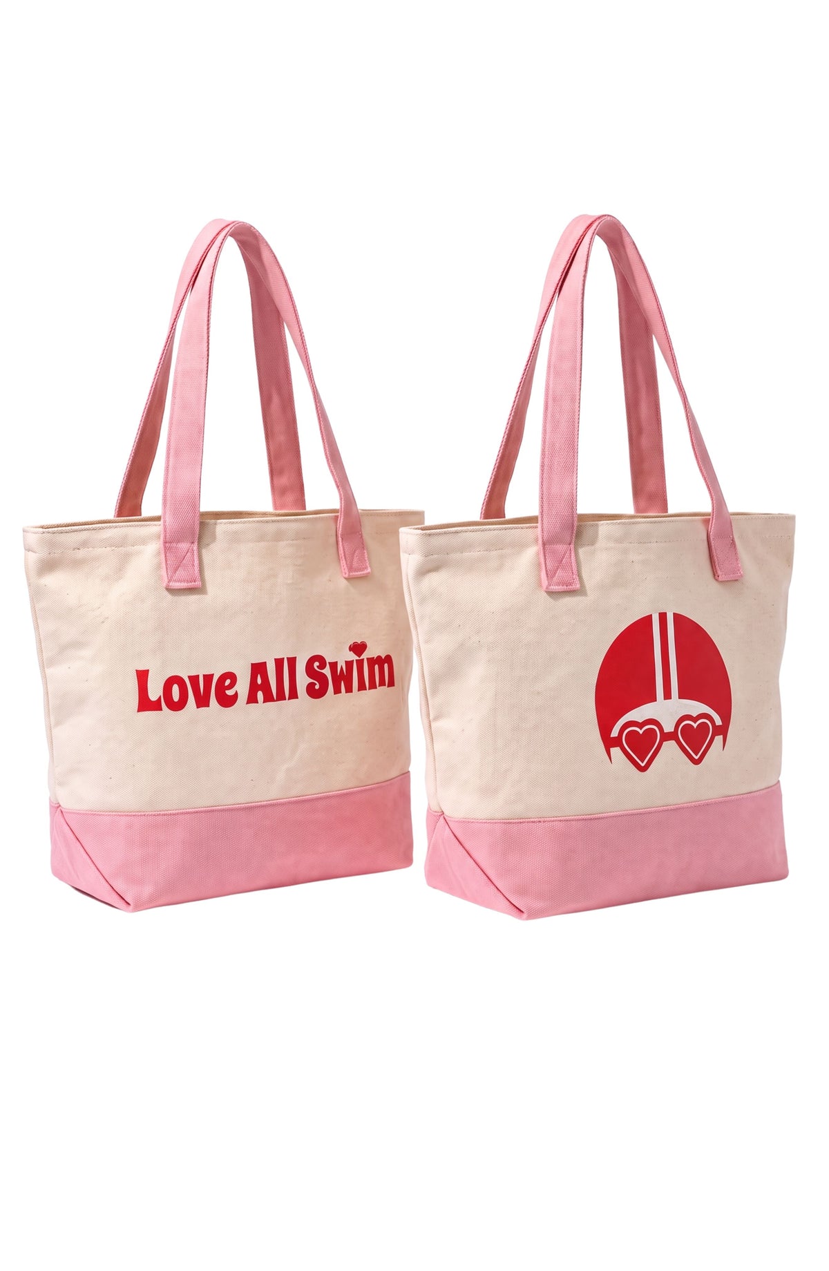 Two canvas tote bags with pink handles and pink bottom panels, shown on a white background. One bag has red text reading 'Love All Swim' and the other has a red swim cap and heart goggles graphic.