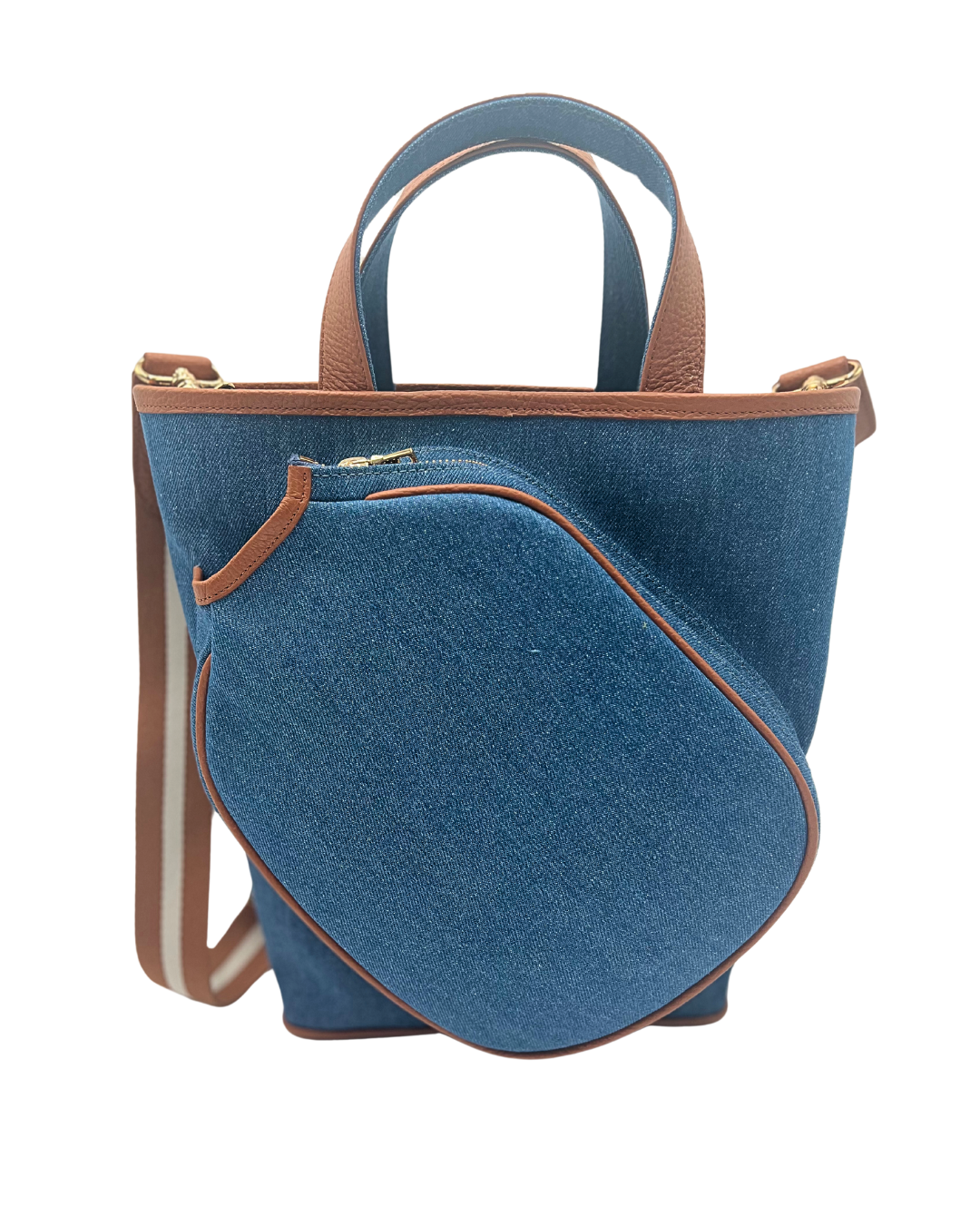 A blue denim bucket bag with brown leather handles and trim, featuring a matching zippered pouch in front and a striped shoulder strap, shown on a plain white background.