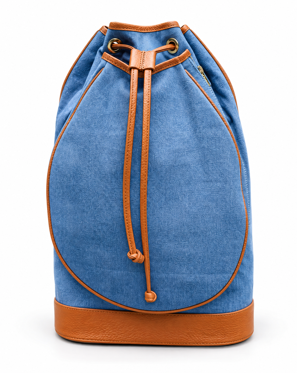 A blue denim drawstring backpack with tan leather trim and a matching tan leather base, shown against a plain white background.