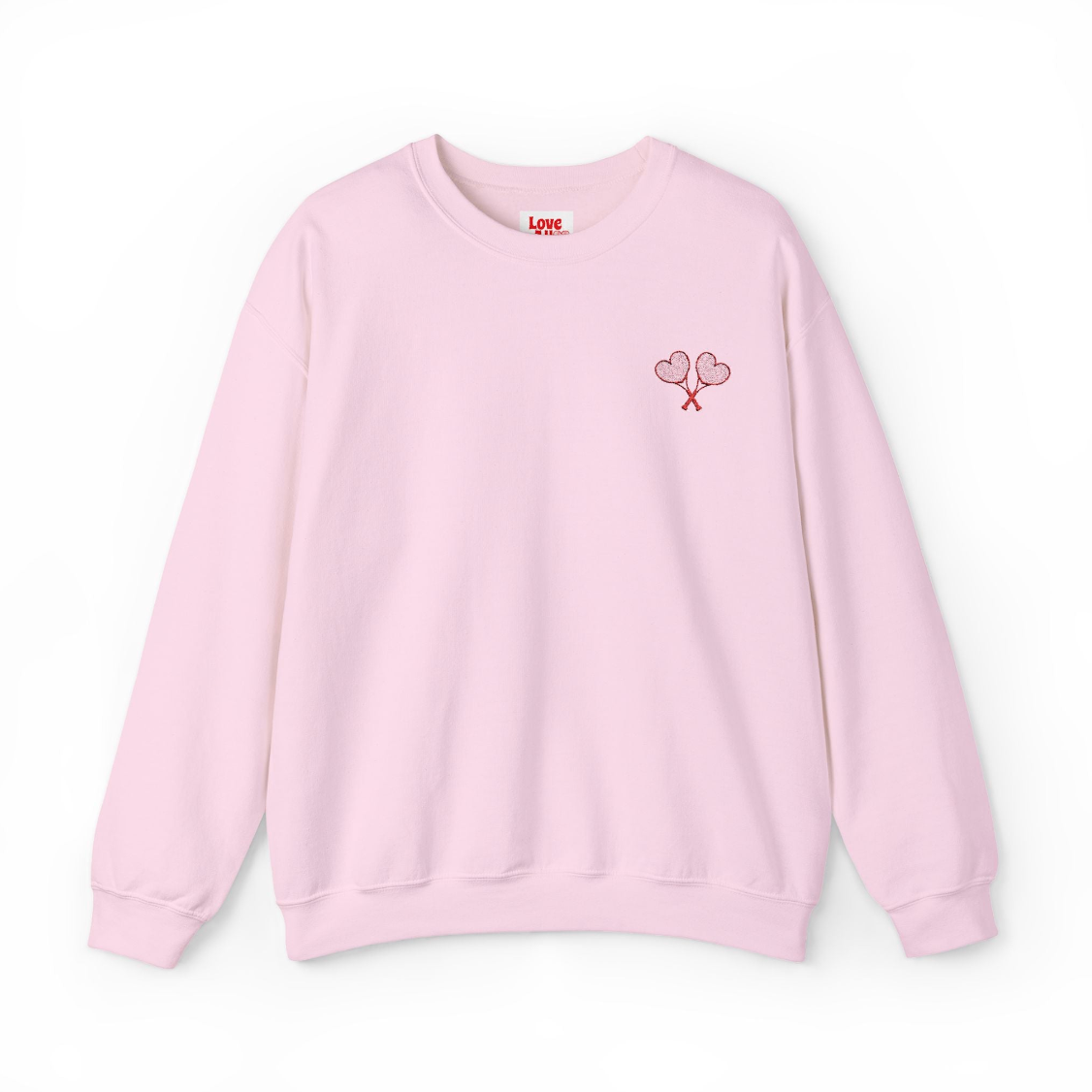 Pink sweatshirt with a small design on the chest against a white background