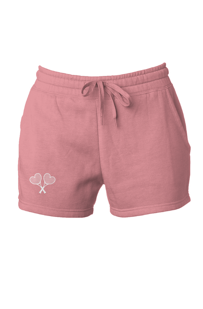 Pink shorts with a logo on a white background