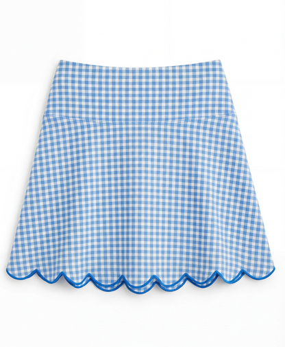 Blue and white gingham skirt with blue scalloped hem on a flat white background