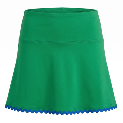A bright green athletic skort with a blue scalloped trim along the hem, shown against a plain white background.