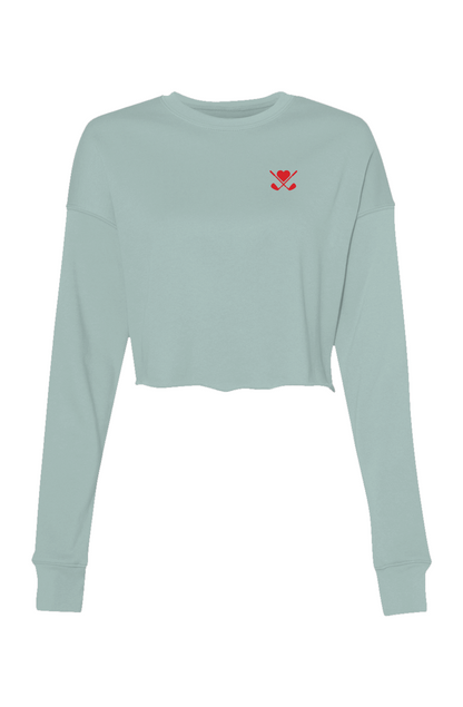 Light blue long-sleeve crop top with a red heart and cross design on a white background