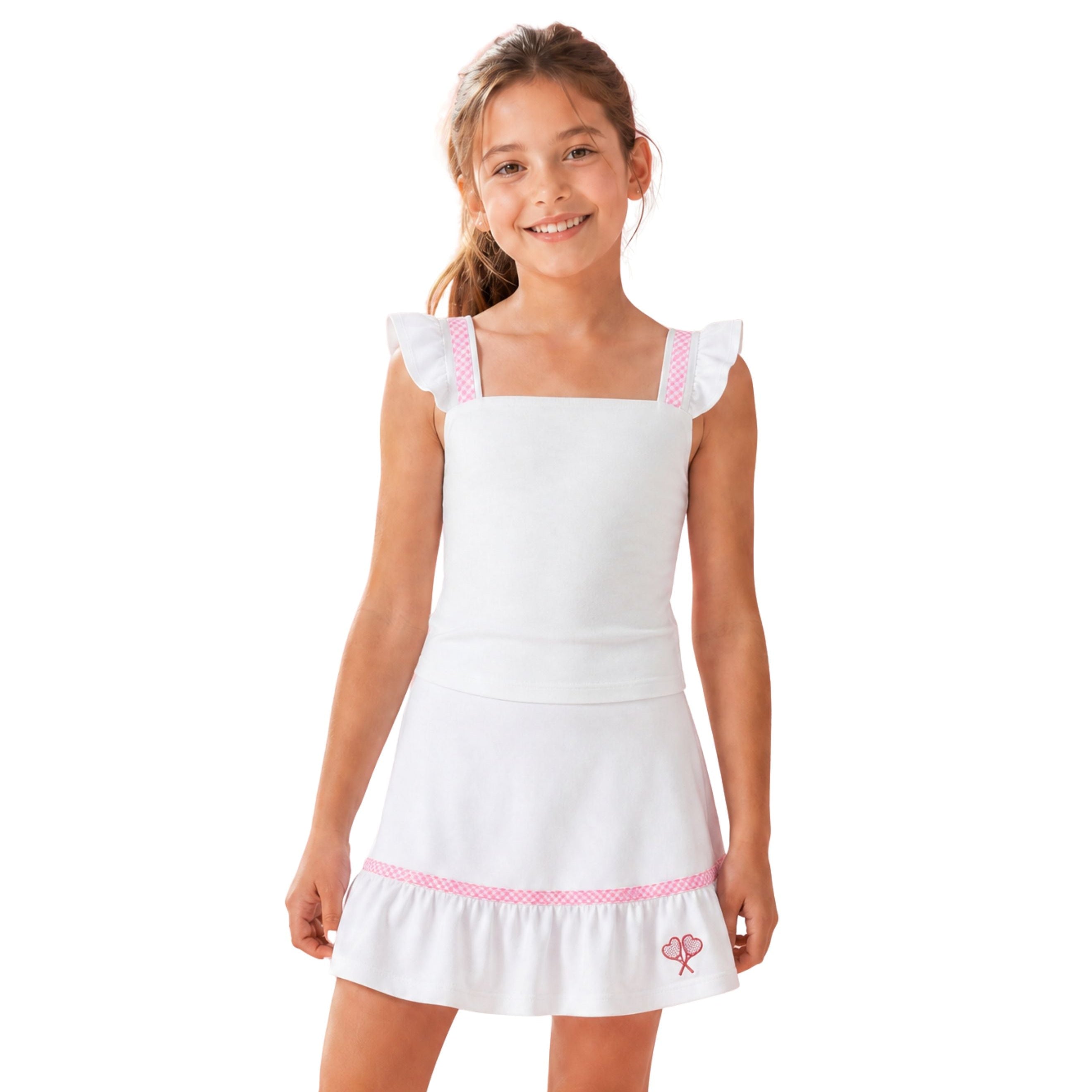 Young girl wearing a white dress with pink trim on a white background