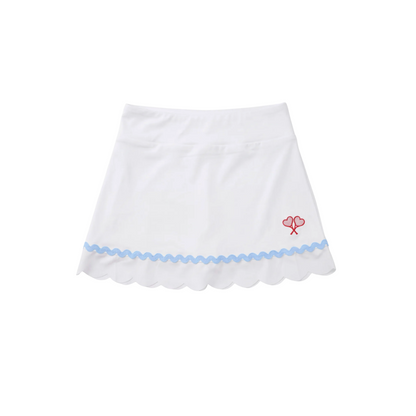 White skirt with blue trim and red heart design on a white background