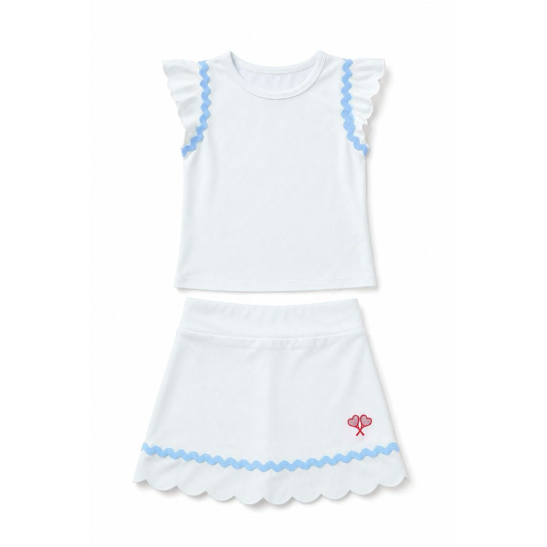 White top and skort with blue trim and a red heart design on a white background