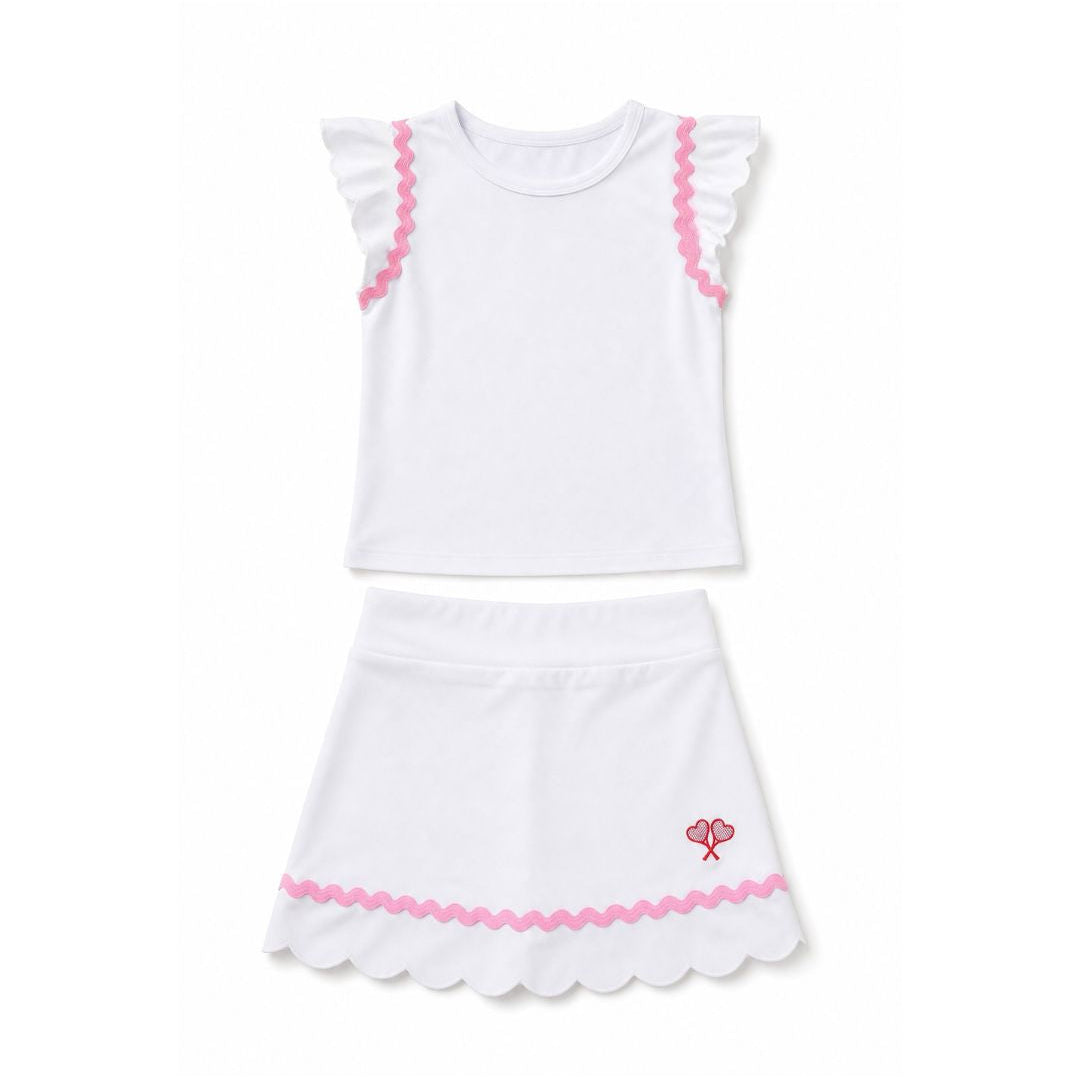 White top and skirt with pink trim on a white background