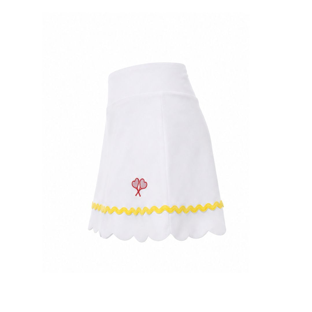 White skirt with yellow trim and red flower design on a white background