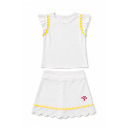 White top and skirt set with yellow trim on a white background