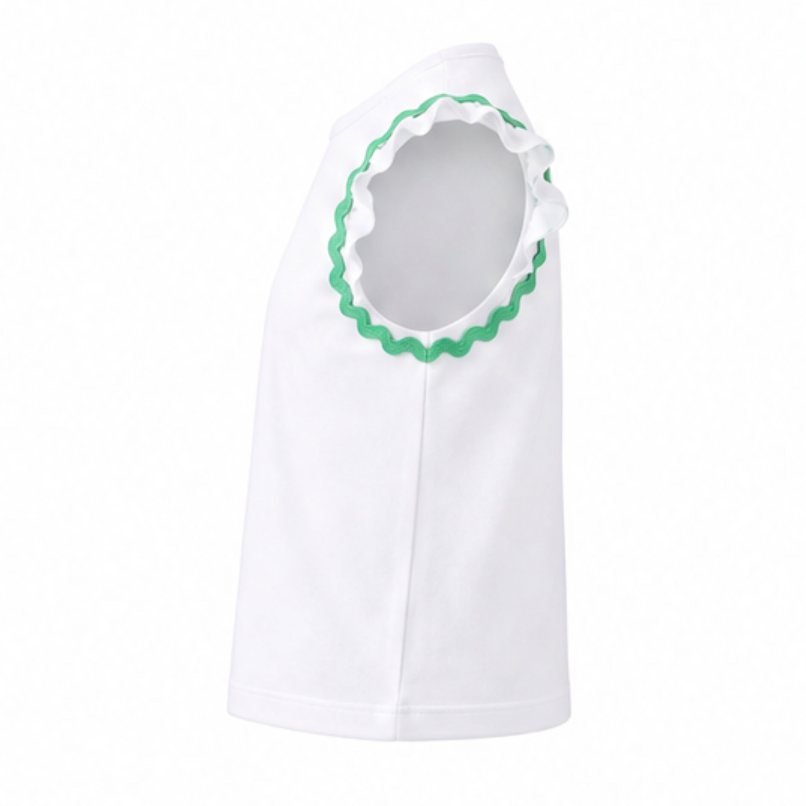 White baby outfit with green trim on a white background