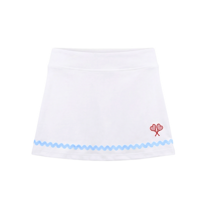White skirt with blue trim and red floral design on a white background