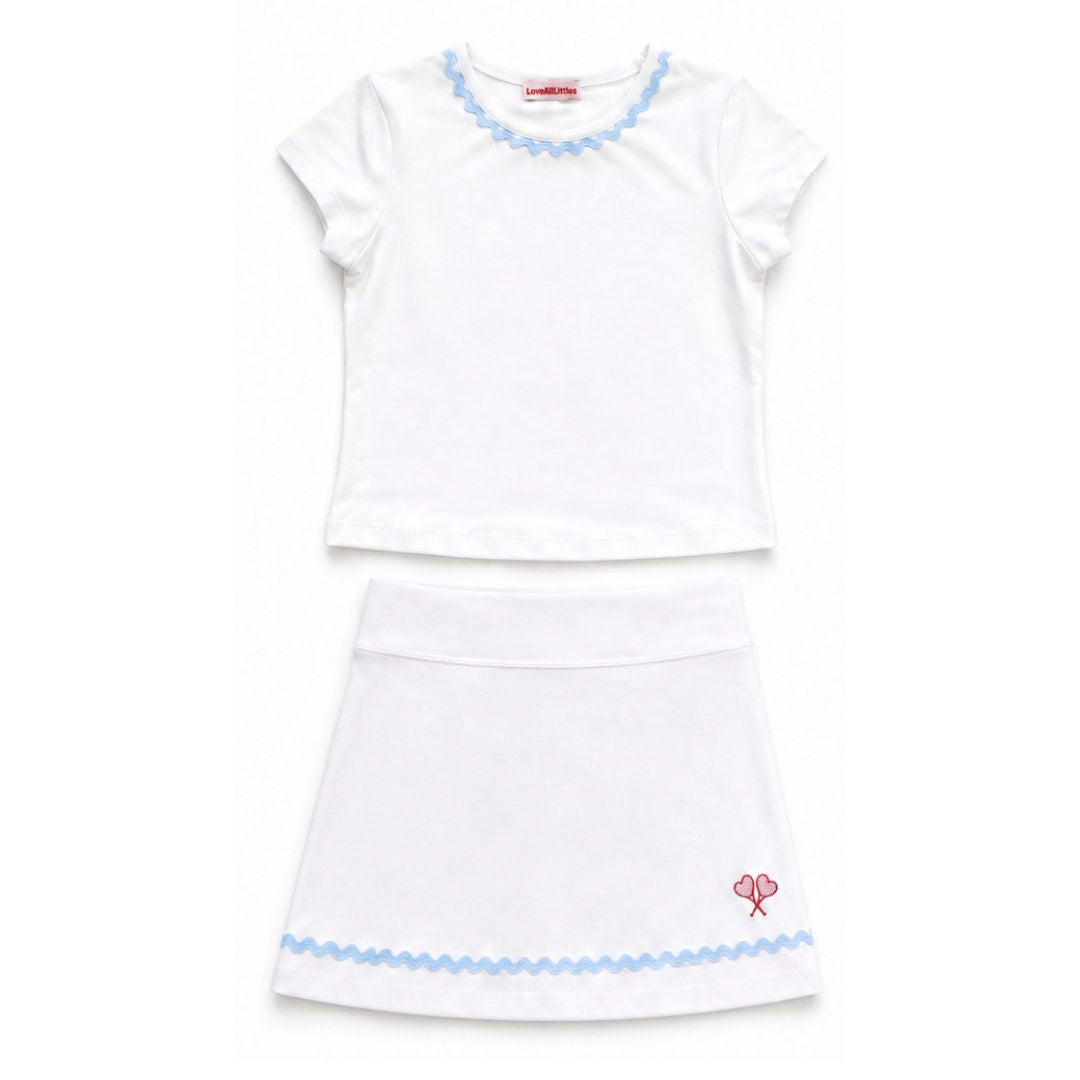 White tennis outfit with blue trim on a white background