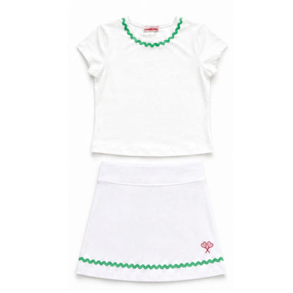 White top and skirt set with green trim on a white background