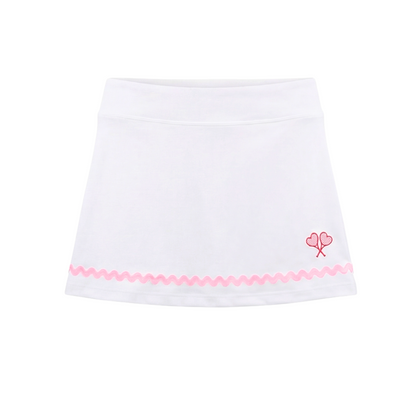 White skirt with pink trim and floral design on a white background