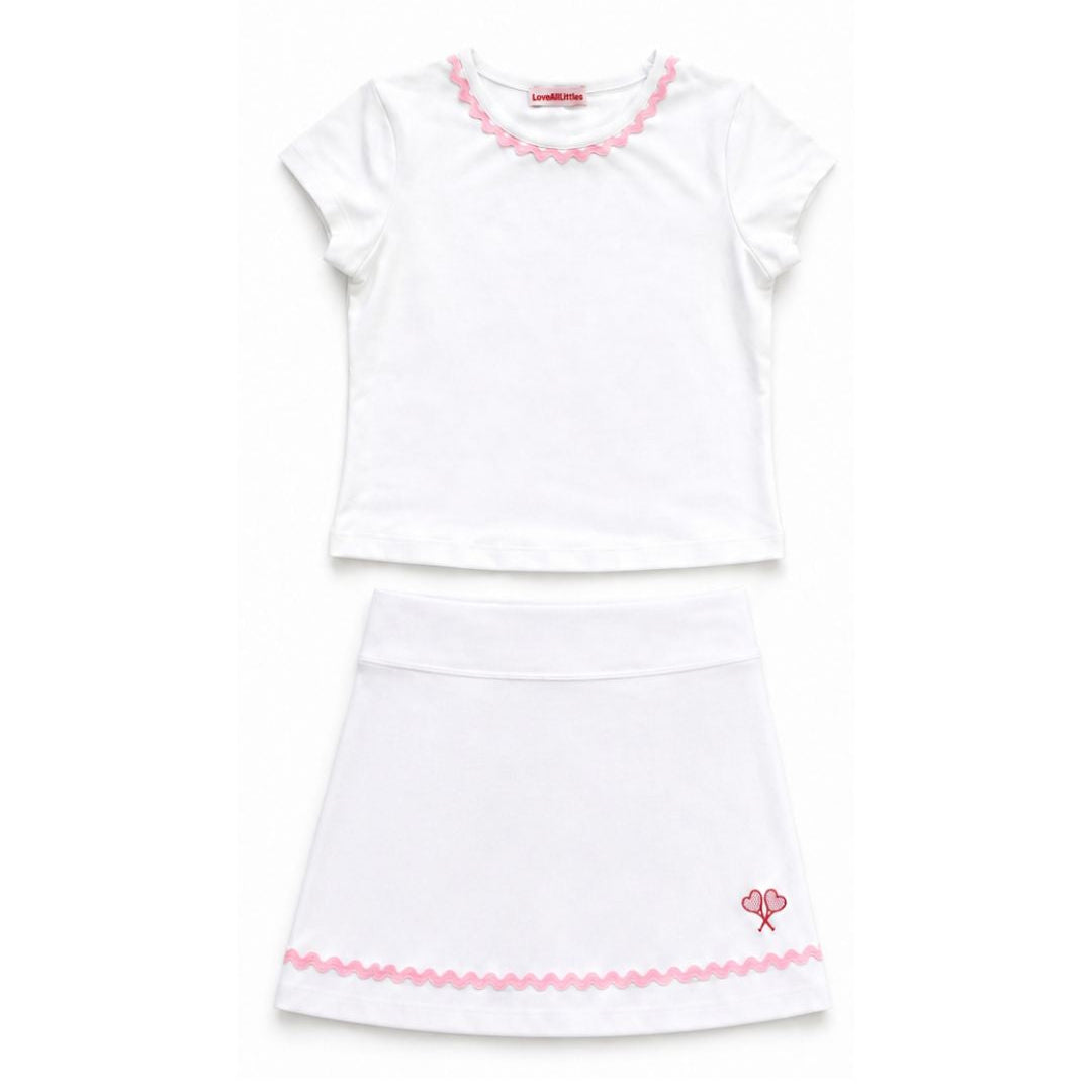 White dress with pink trim on a white background
