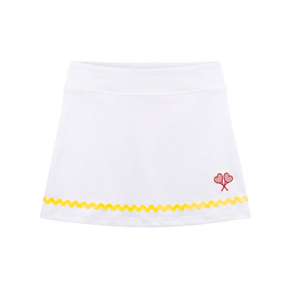 White skirt with yellow trim and red heart design on a white background