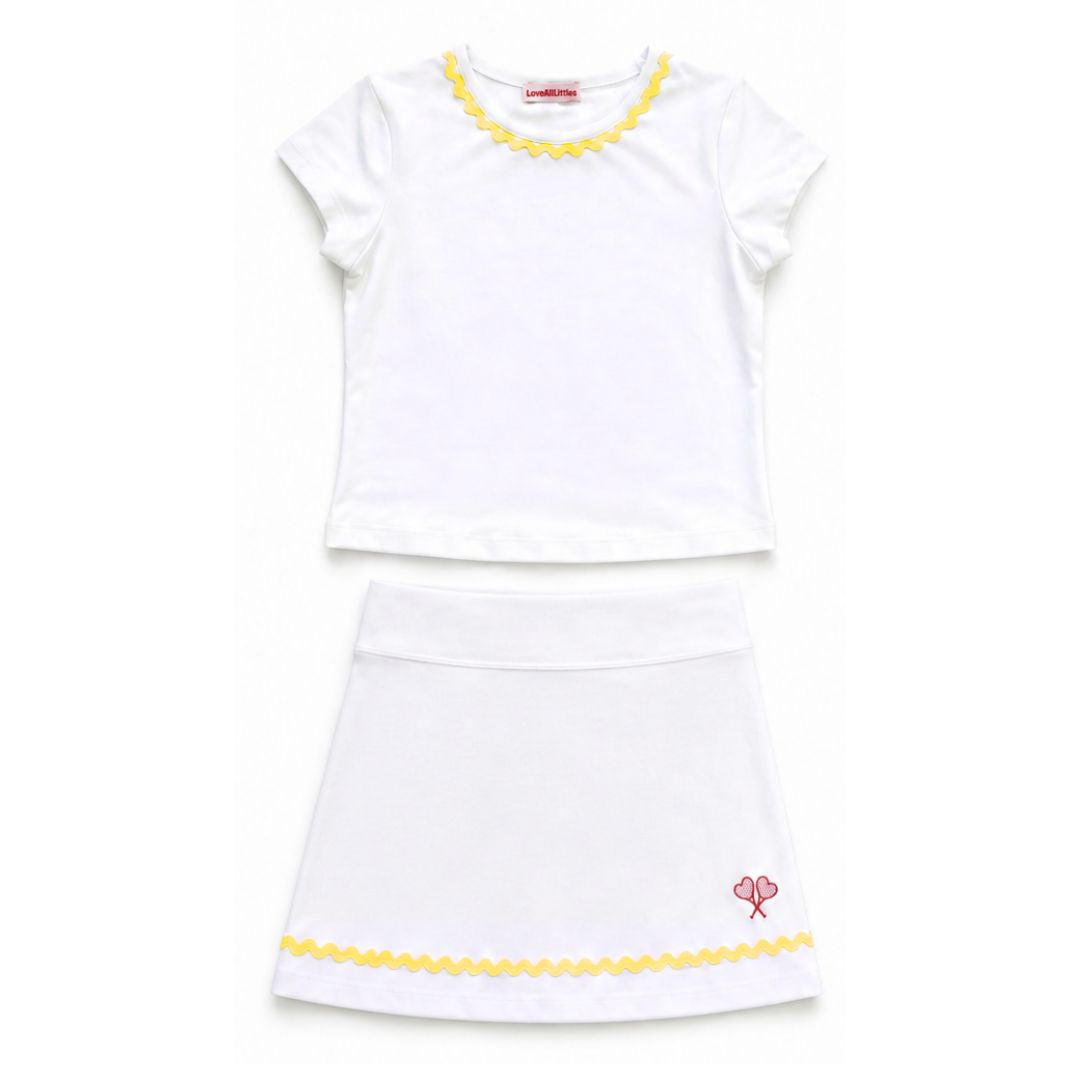 White dress with yellow trim on a white background
