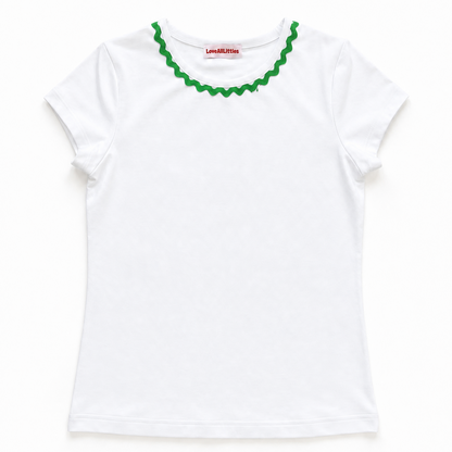 White t-shirt with green ruffled collar on a white background