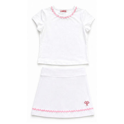 White top and skirt with pink trim on a white background
