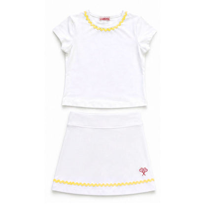 White top and skirt with yellow trim on a white background
