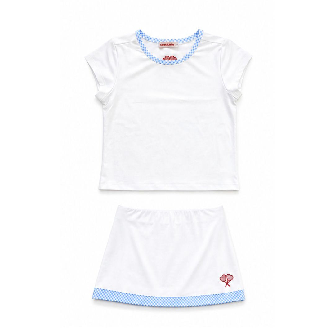 White tennis outfit with blue trim on a white background