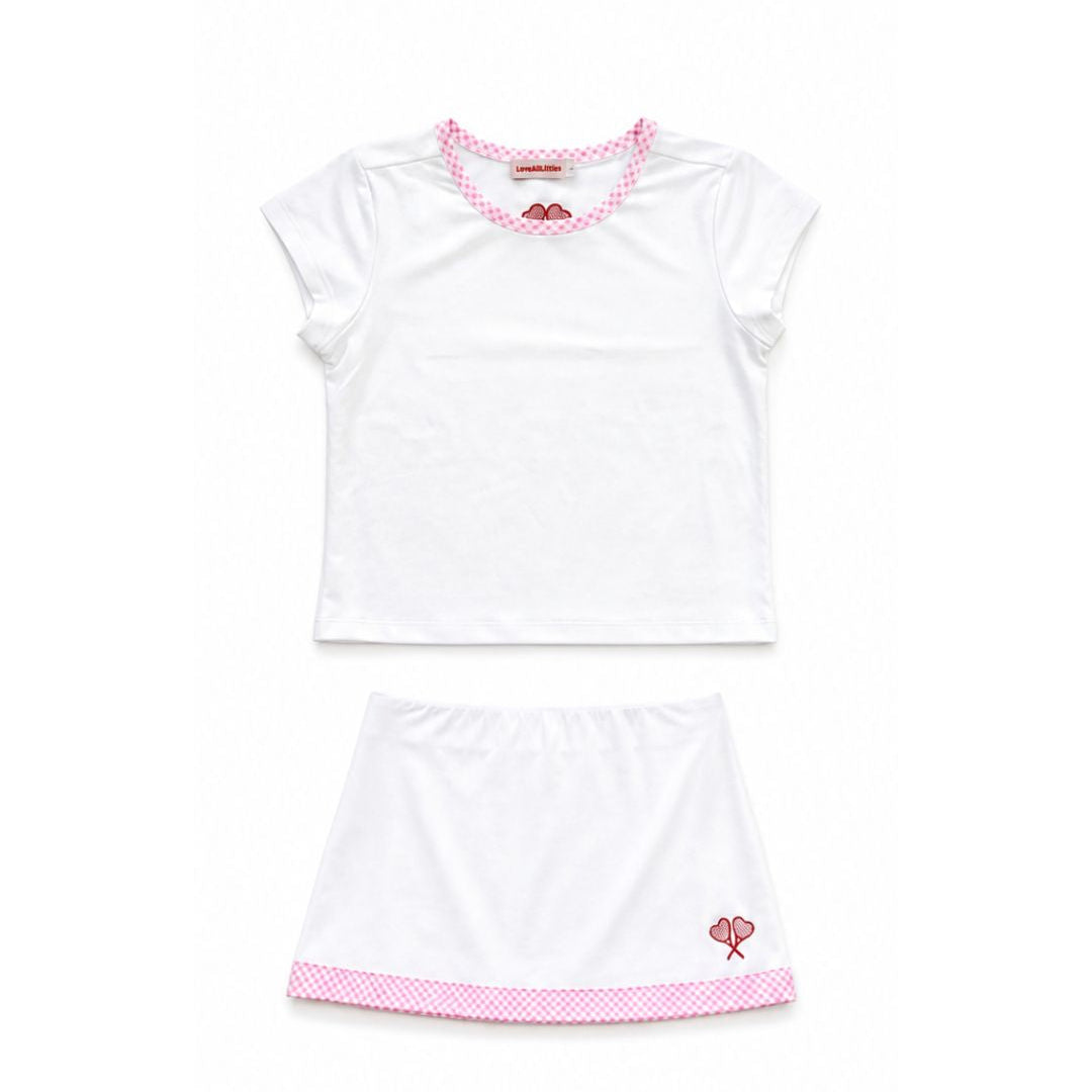 White outfit with pink accents on a white background