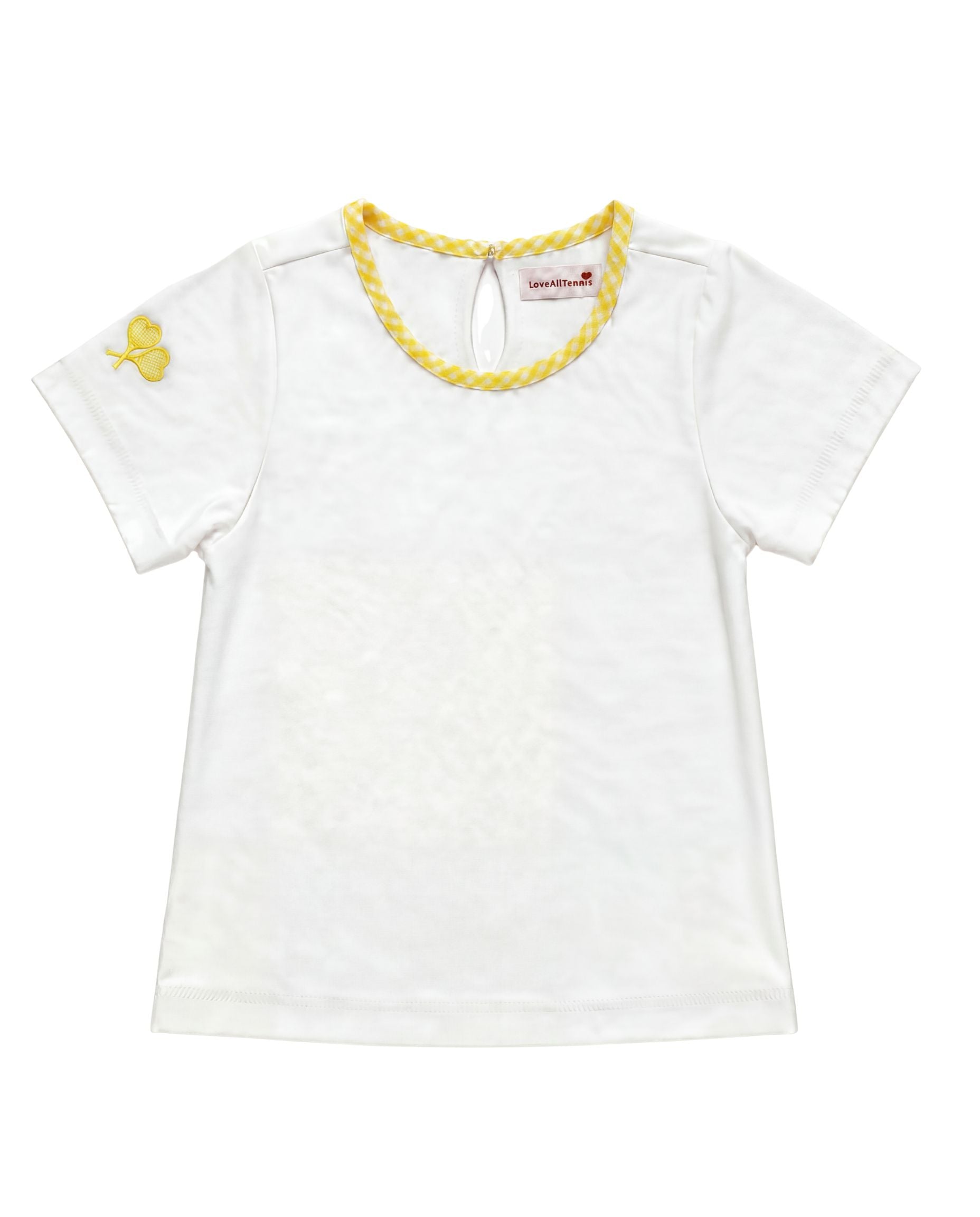 A white short-sleeve baby tee with a yellow braided trim around the crew neck and a small yellow embroidered crossed heart tennis rackets on the left sleeve, shown flat on a white background.