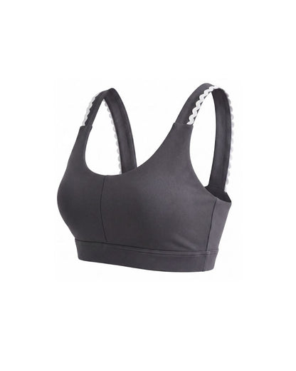 Grey sports bra with white trim on a white background