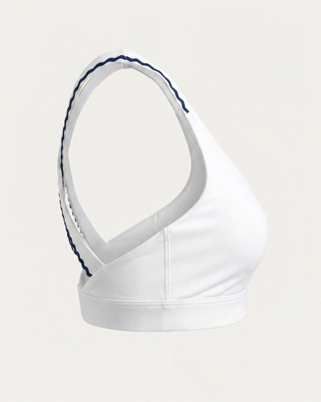 White sports bra with blue trim on a light gray background