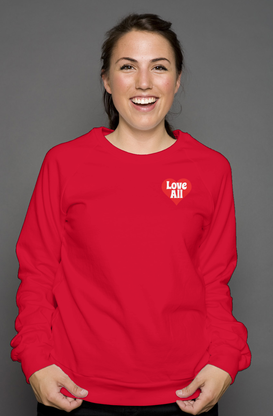 Person wearing a red sweatshirt with 'Love All' text on a gray background