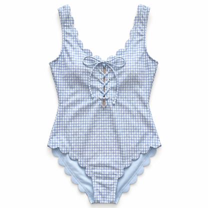 A light blue and white gingham one-piece swimsuit with scalloped edges, featuring a lace-up front detail, shown flat against a white background.