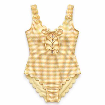 A yellow and white gingham one-piece swimsuit with scalloped edges and a lace-up front, displayed flat against a white background.