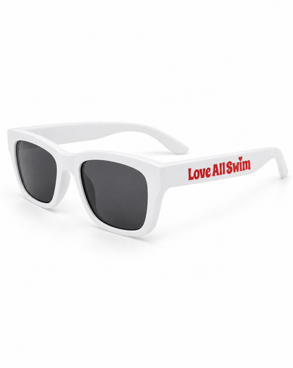 White sunglasses with red text "Love All Swim" on the side shown on a white background