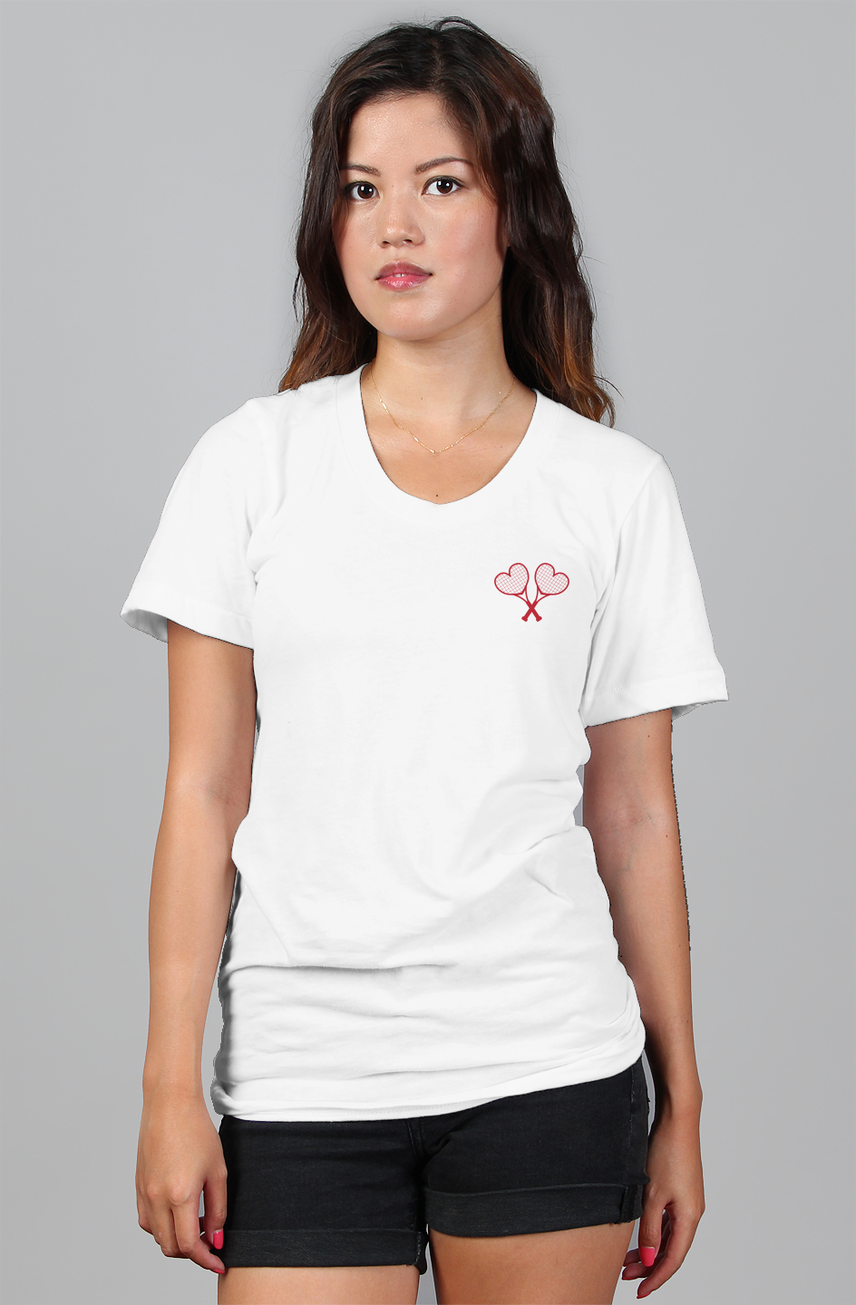 White t-shirt with a crossed heart tennis racket design on a gray background
