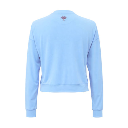 A light blue cropped sweatshirt shown from the back, featuring a small embroidered pink bow on the upper back, set against a plain white background.