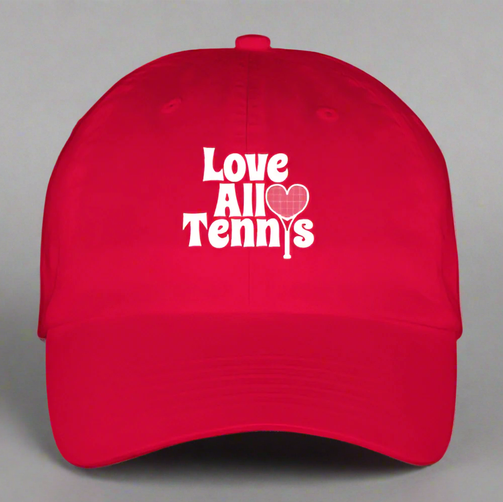 Red cap with 'Love All Tennis' text and heart design on a gray background
