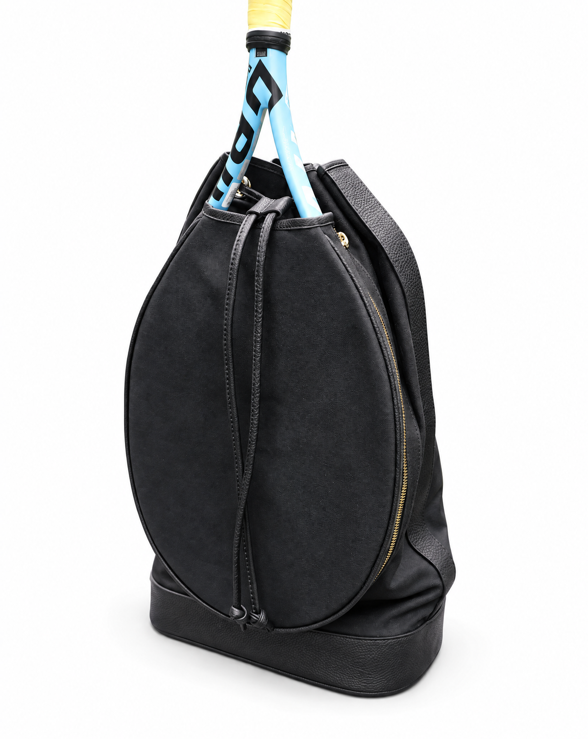A black tennis bag with a drawstring closure and a gold zipper, shown on a white background with a tennis racket tucked inside.